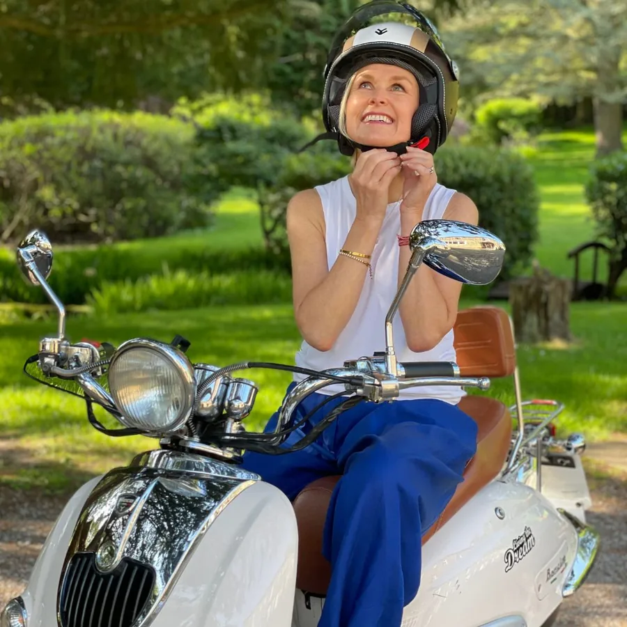 Sarah Clough on her moped